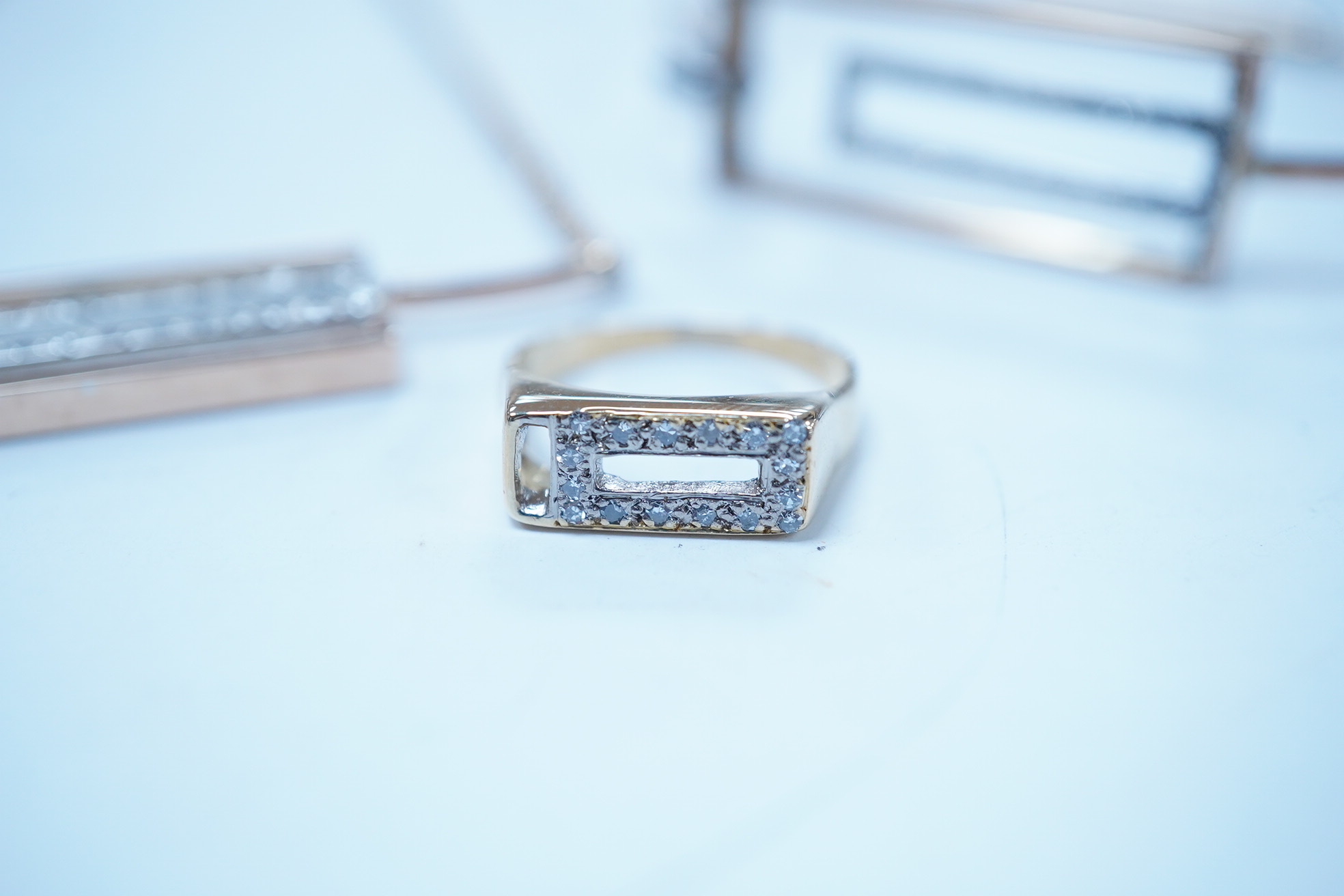 A modern suite of 9ct gold and diamond chip set jewellery, including a ring, bracelet and necklace, 38cm, gross weight 20.8 grams. Condition - fair to good